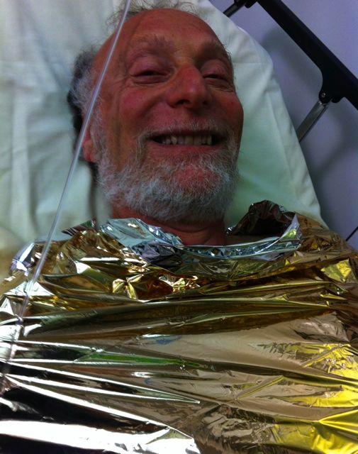 Harvey, in the pompiers' ambulance, wrapped like a saucisson.