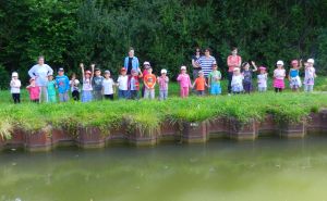 Hiking school kids wave at the barge. There's no time to reach for the camera in the car for sights like this.